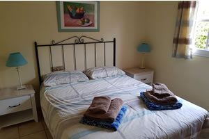 Image of bedroom with a large double bed
