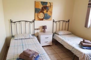 Image of bedroom with two single beds